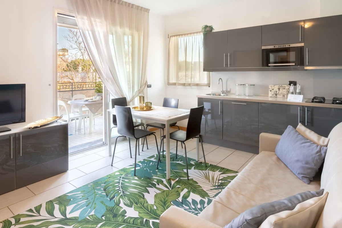 D-Three Suite — cucina attrezzata e zona pranzo